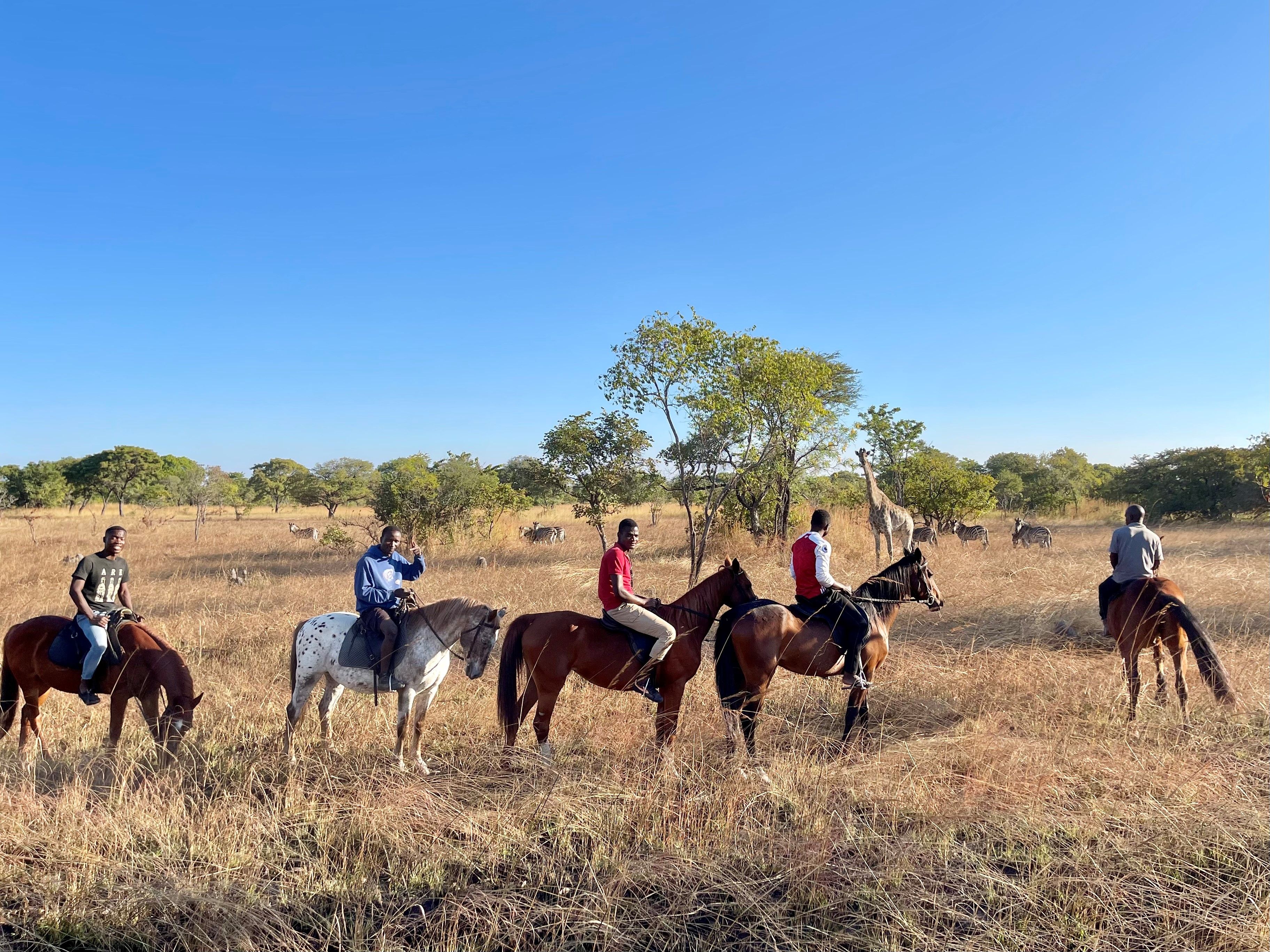 Horseback-riding-game-viewing-Kuti-Malawi-wildlife-giraffe-and-zebras