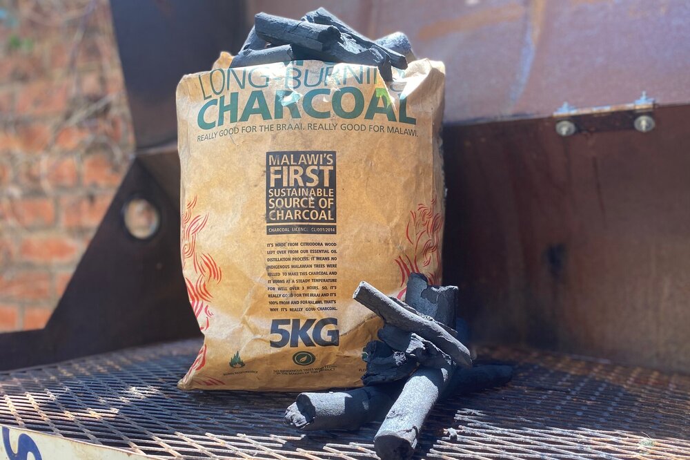 KHPsustainablecharcoal5kgbagandcharcoalpiecesonbreakgrilloutside